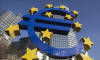 ECB holds interest rates at record highs, lowers inflation forecasts