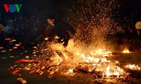Barefoot Dao men dance on red hot charcoals