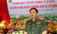 Defense minister pays official visit to Laos, attends ADMM-10