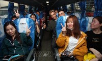 Free buses take workers home for Tet