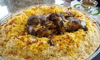 How does Saudi cuisine differ from the cuisine of neighboring countries?