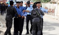 Irak: le vote des forces de sécurité endeuillé par des attentats, 57 morts