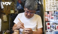Hanoi artisan preserves craft of hand-carved wood stamps in Old Quarter