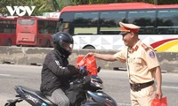 Traffic police help people on the way home for Tet
