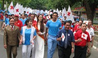 About 8,000 people join a walk for AO victims