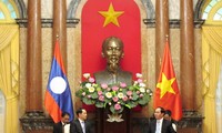 President Tran Dai Quang appreciates Vietnam, Lao cooperative orientations