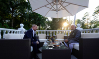 President Putin welcomes PM Modi at his residence