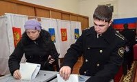 Russians cast their ballots to elect parliament