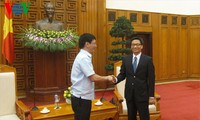 越南政府副总理武德担会见东盟记者团