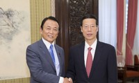 日本和中国一致同意推动双边关系发展