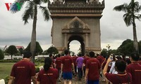 Laos mengadakan lomba gerak jalan demi kesehatan sehubungan dengan peringatan ultah ke-49 Berdirinya ASEAN