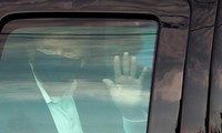 Infected Trump greets supporters in motorcade outside hospital
