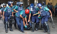 97 killed in unrest, Bangladesh imposes curfew