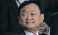 Thai court issues arrest warrant for Thaksin