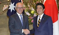 Australia, Japan vow to sign trans-Pacific trade pact