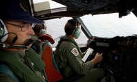 Australia shifts search zone for missing flight MH370 