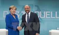 Merkel's CDU agrees to pursue grand coalition in Germany