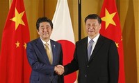 Abe, Xi vow to boost regular, close communication 