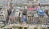 60 people trapped, missing in building collapse in China