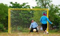 When ethnic women in traditional skirts play football in Vietnam