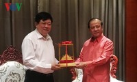 老挝新闻文化和旅游部部长波显坎•冯达拉会见本台台长阮世纪