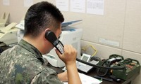Two Koreas fully restore western military communication line