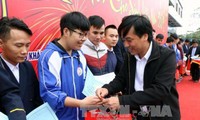 Poor people receive aid for Tet celebration