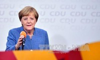 German Chancellor announces coalition talks with FDP, Greens
