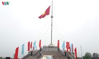 На берегах реки Бенхай прошла церемония поднятия флага в знак воссоединения страны
