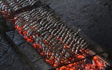 Grilled fish making village busy on scorching summer days