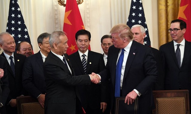 中美承诺继续落实中美第一阶段经贸协议