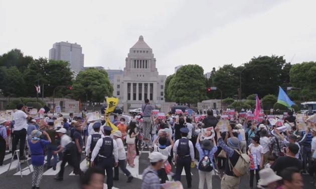 Thousands march outside Japan parliament to protest US military base