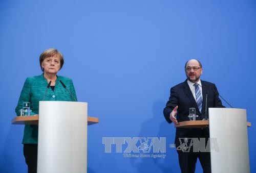 Angela Merkel's CDU approves coalition deal with SPD