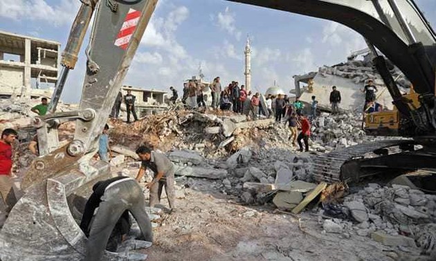 US-led coalition air strikes kill 14 civilians in east Syria