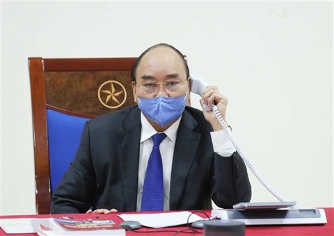 Covid-19: conversation téléphonique entre les Premiers ministres vietnamien et chinois