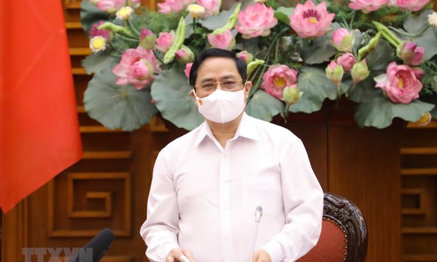 越南政府总理范明政呼吁全民携手抗击疫情