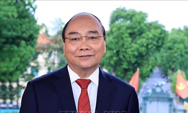 越南国家主席阮春福赞扬新冠肺炎疫情防控战线上的新闻工作者