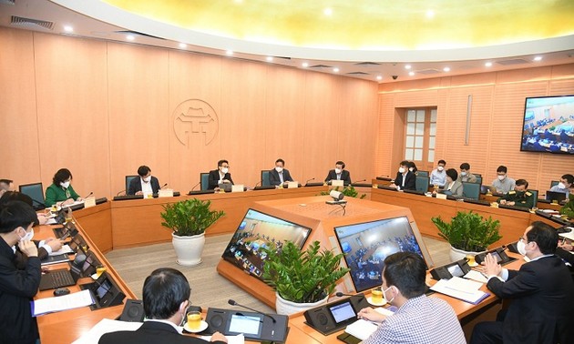 政府副总理武德担与河内市举行新冠肺炎疫情防控工作会议