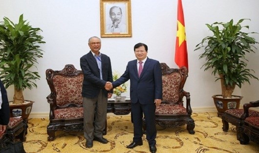 Deputi PM Trinh Dinh Dung menerima Deputi Menteri Energi dan Pertambangan Laos