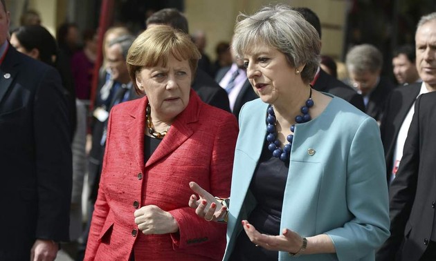 PM Inggris mendapat dukungan dari kabinet baru dan Kanselir Jerman.