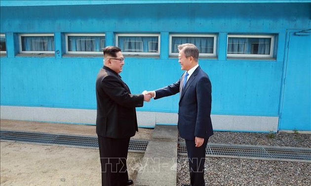 Two Koreas mark Moon-Kim summit anniversary with different tones