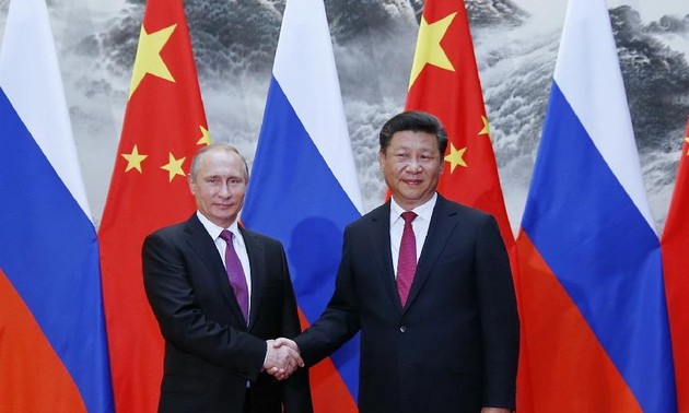 China, Russia sign over 30 cooperative deals