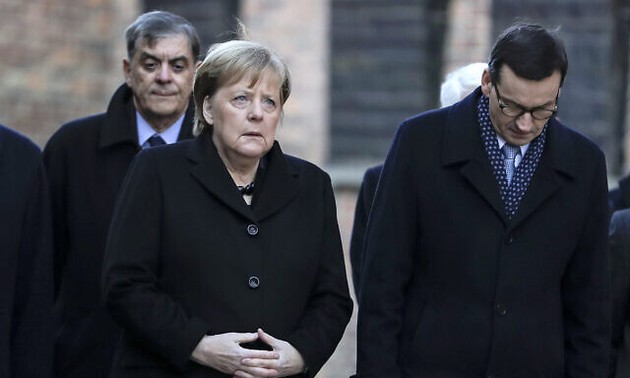  Angela Merkel makes first Auschwitz trip as German leader
