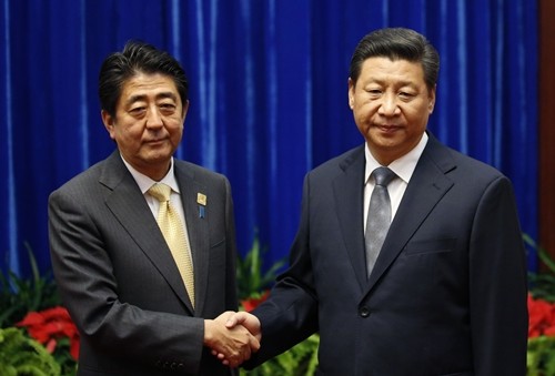 China urges Japan to abide by four-point agreement