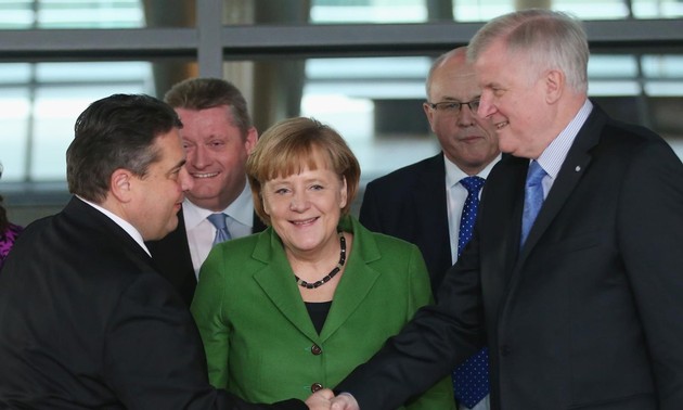 German Chancellor Merkel agrees to establish coalition government with SPD 