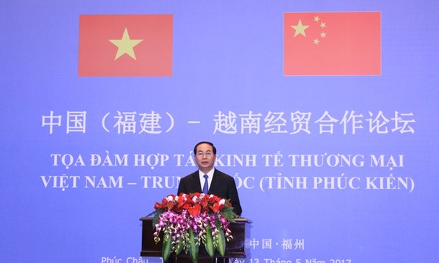 Чан Дай Куанг принял участие в симпозиуме по торгово-экономическому сотрудничеству между СРВ и КНР