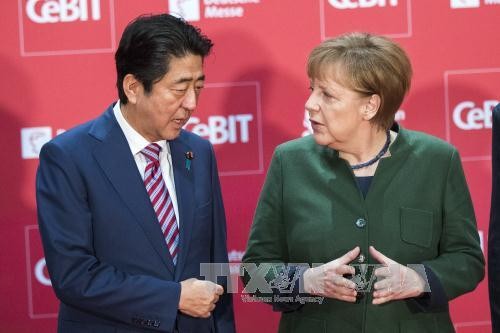 Abe et Merkel plaident pour le libre-échange