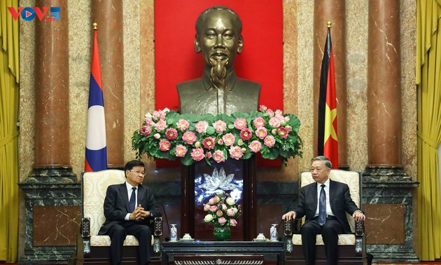 Президент То Лам принял генерального секретаря ЦК НРПЛ,  президента Лаоса Тхонглуна Сисулита