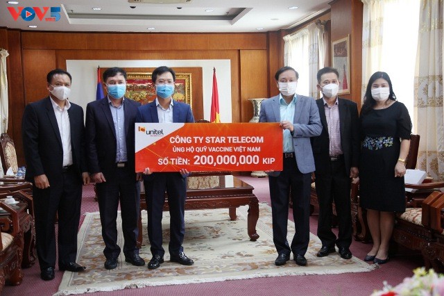 Các địa phương, doanh nghiệp tại Lào ủng hộ 30.000 USD giúp Việt Nam chống dịch - ảnh 1