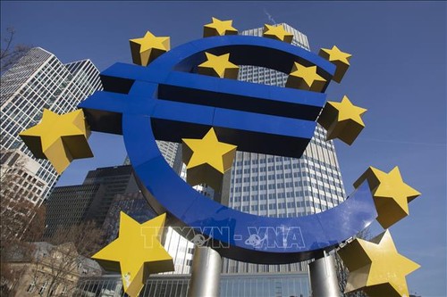 ECB holds interest rates at record highs, lowers inflation forecasts